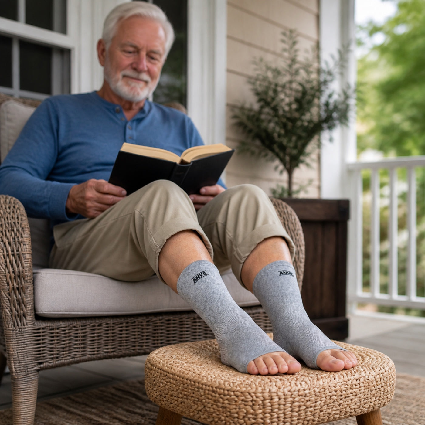 Person on a covered porch in gray toeless ANVIL foot sleeves.