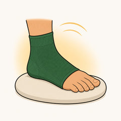 Illustration of a foot in a green sleeve resting on a pale cushion, with a soft yellow glow behind it.